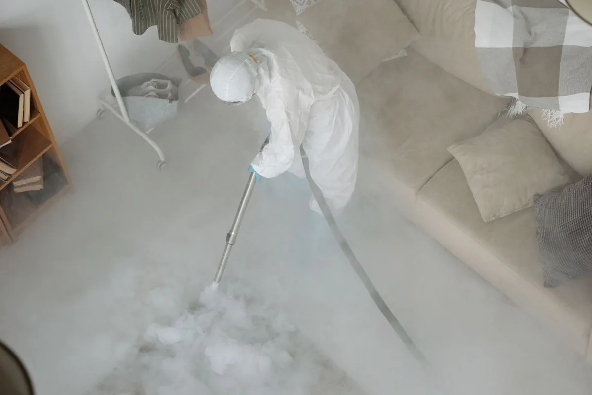 Biohazard cleanup technician in protective equipment, Darlington, WI